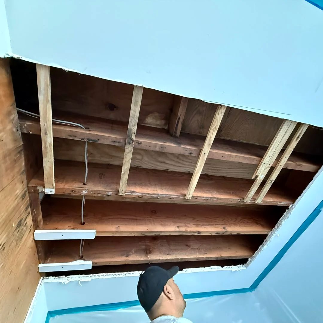 Pro-Elite Drywall crew member rebuilding a ceiling